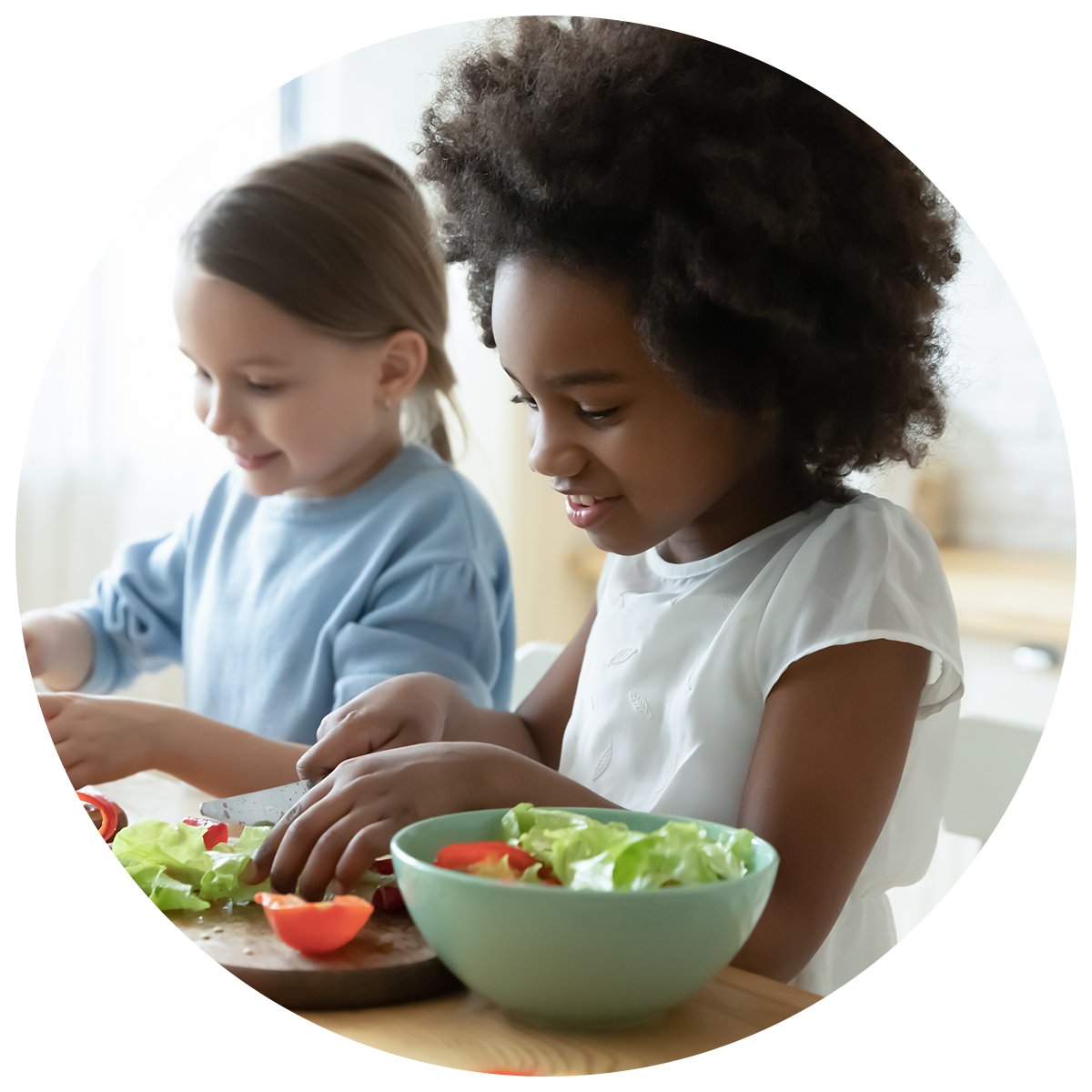 Two children enjoying cooking and culinary activities.