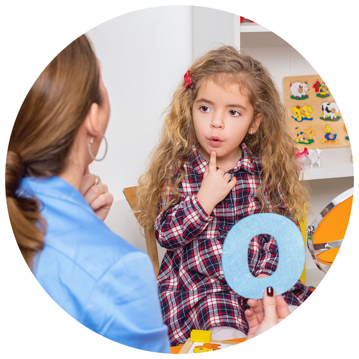 Child learning sign language as a part of a language and culture activity.