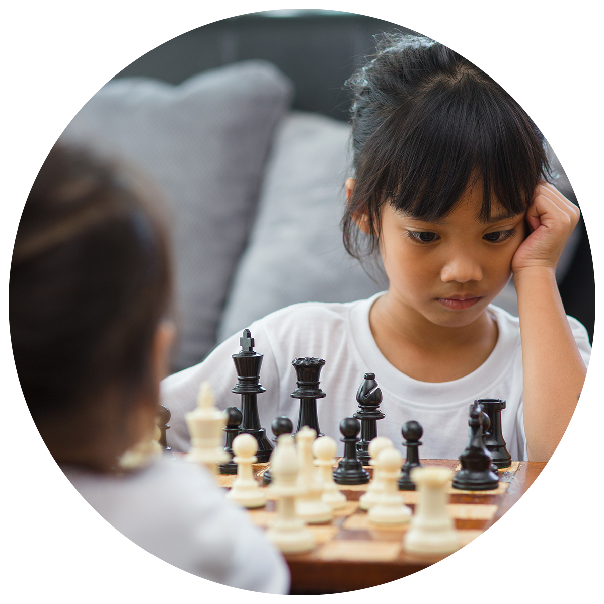 two children enjoying a special interest activity, chess.